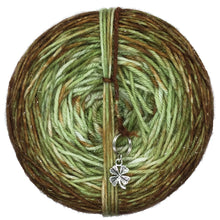Load image into Gallery viewer, Avocado Toast is a double dyed cake of yarn with an avocado green as it&#39;s base and caked dyed with brown to give a final ombre gradient. A clover stitch marker is included with each cake!
