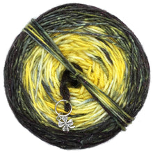 Load image into Gallery viewer, Goldfinch Ranch is what we call our backyard bird feeder! Inspired by the color of the Goldfinch  this colorway is double dyed with golden yellow as it&#39;s base and caked dyed with black to give a final ombre gradient. A clover stitch marker is included with each cake!
