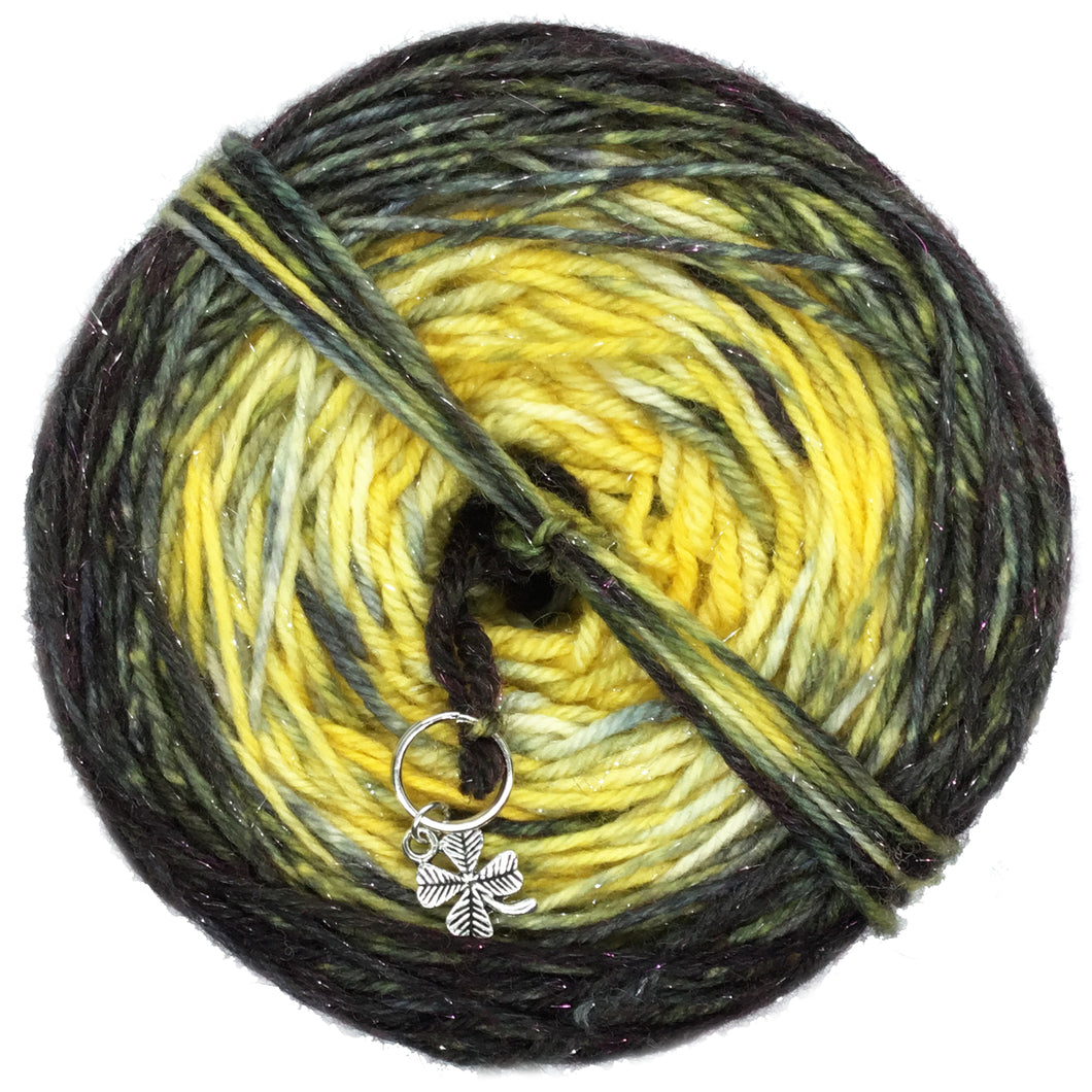 Goldfinch Ranch is what we call our backyard bird feeder! Inspired by the color of the Goldfinch  this colorway is double dyed with golden yellow as it's base and caked dyed with black to give a final ombre gradient. A clover stitch marker is included with each cake!